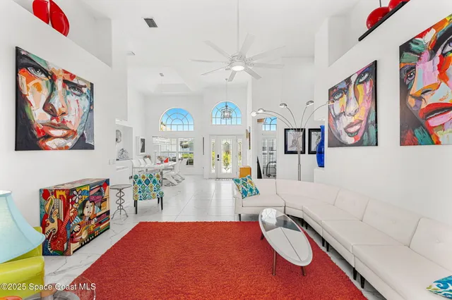 a bedroom with furniture and a wooden floor