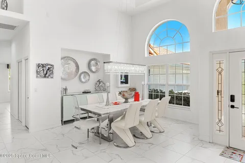 a living room with furniture a fireplace and a table