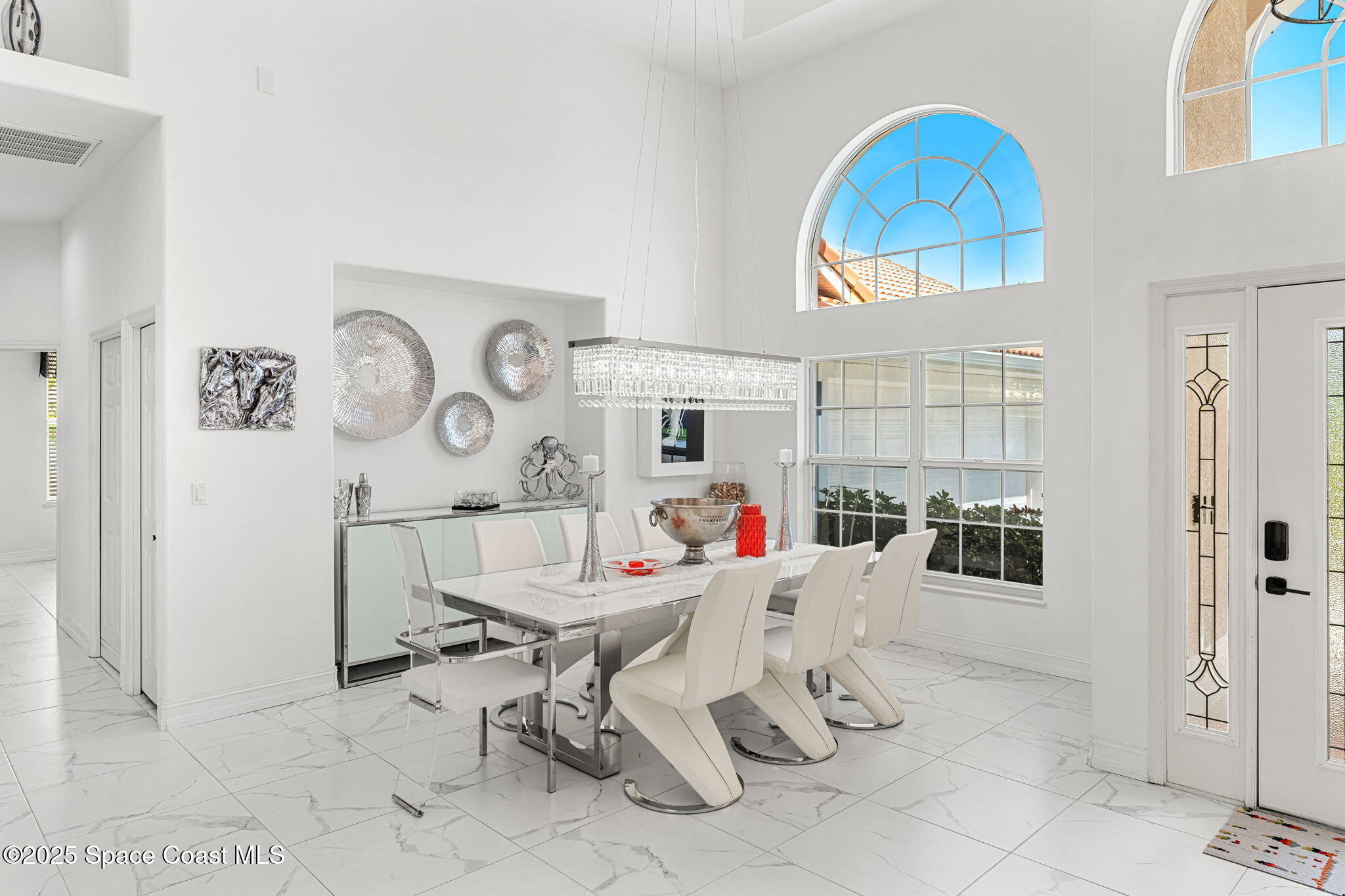 227 Loggerhead Drive Melbourne Beach, FL 32951 - Photo 8 of 52 a living room with furniture a fireplace and a table