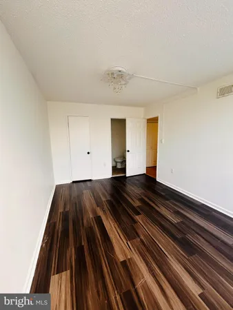 a view of bedroom and wooden floor
