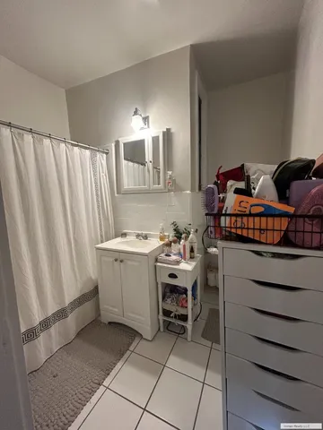 a view of a bathroom with a sink and a mirror