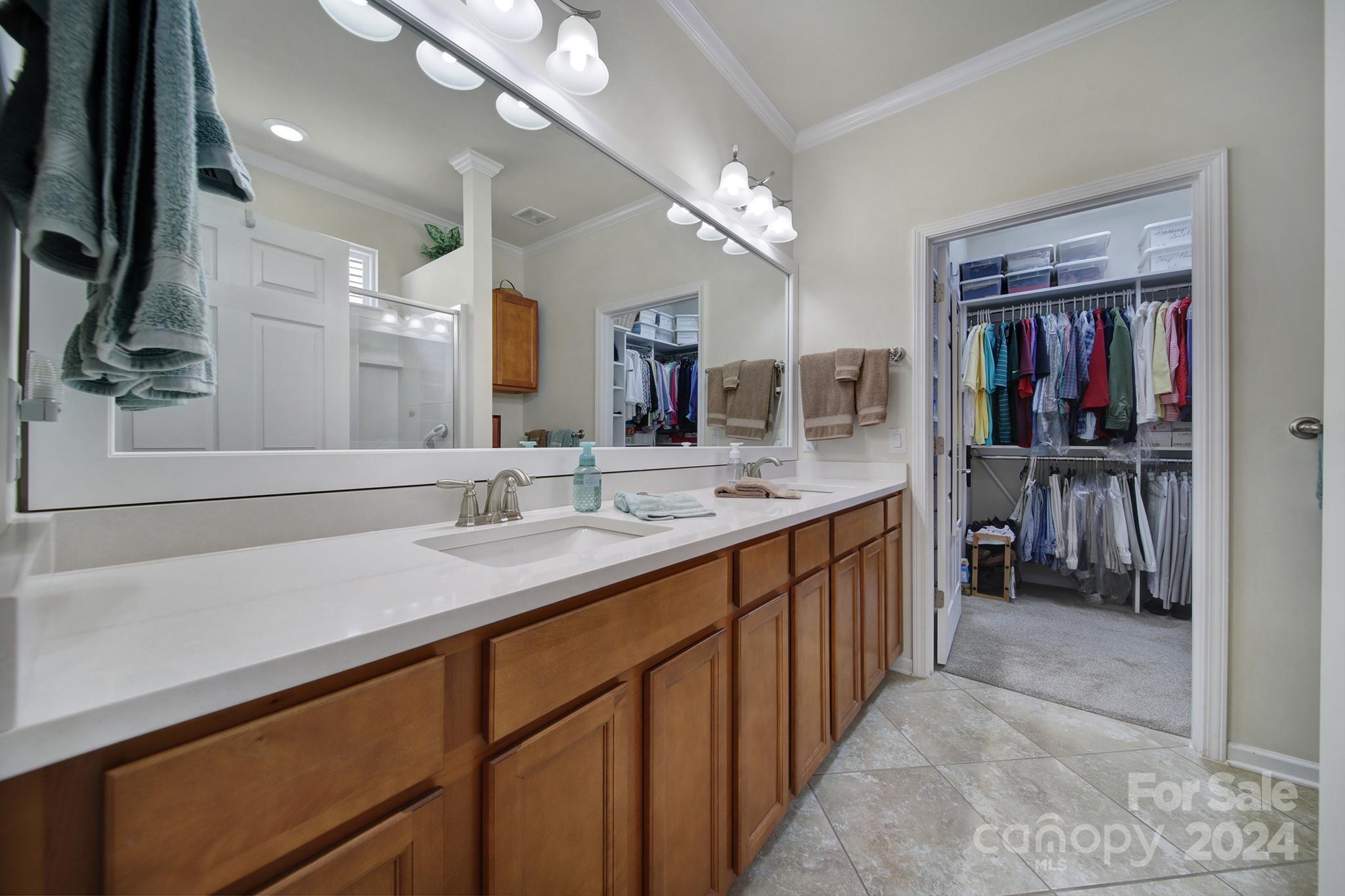 3055 Everett Lane Fort Mill, SC 29707 - Photo 18 of 40 a bathroom with a sink a vanity and a large mirror