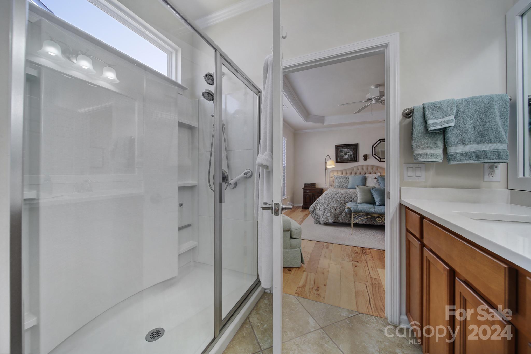 3055 Everett Lane Fort Mill, SC 29707 - Photo 19 of 40 a bathroom with a granite countertop shower a sink and a mirror