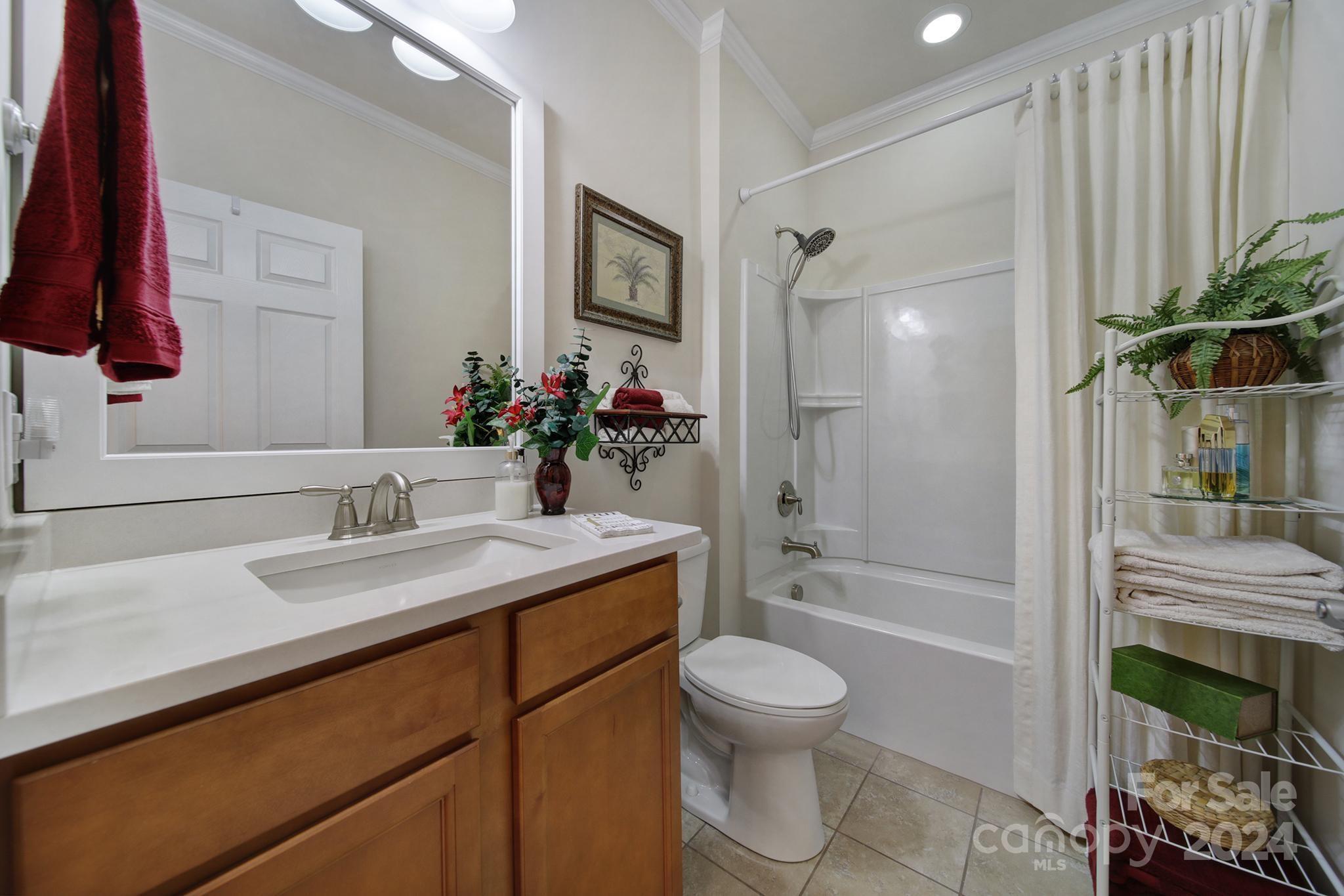 3055 Everett Lane Fort Mill, SC 29707 - Photo 22 of 40 a bathroom with a granite countertop sink toilet and shower