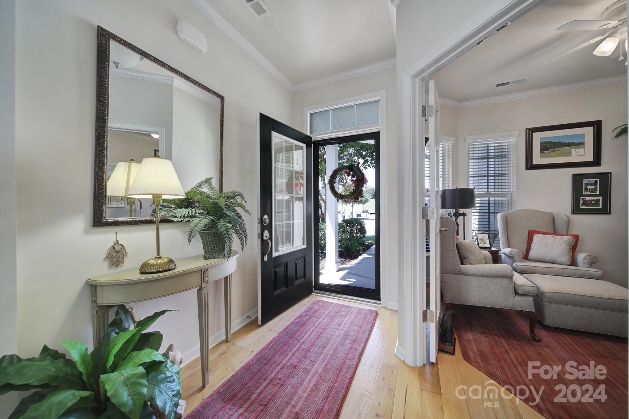 3055 Everett Lane Fort Mill, SC 29707 - Photo 3 of 40 a living room with furniture and a chandelier