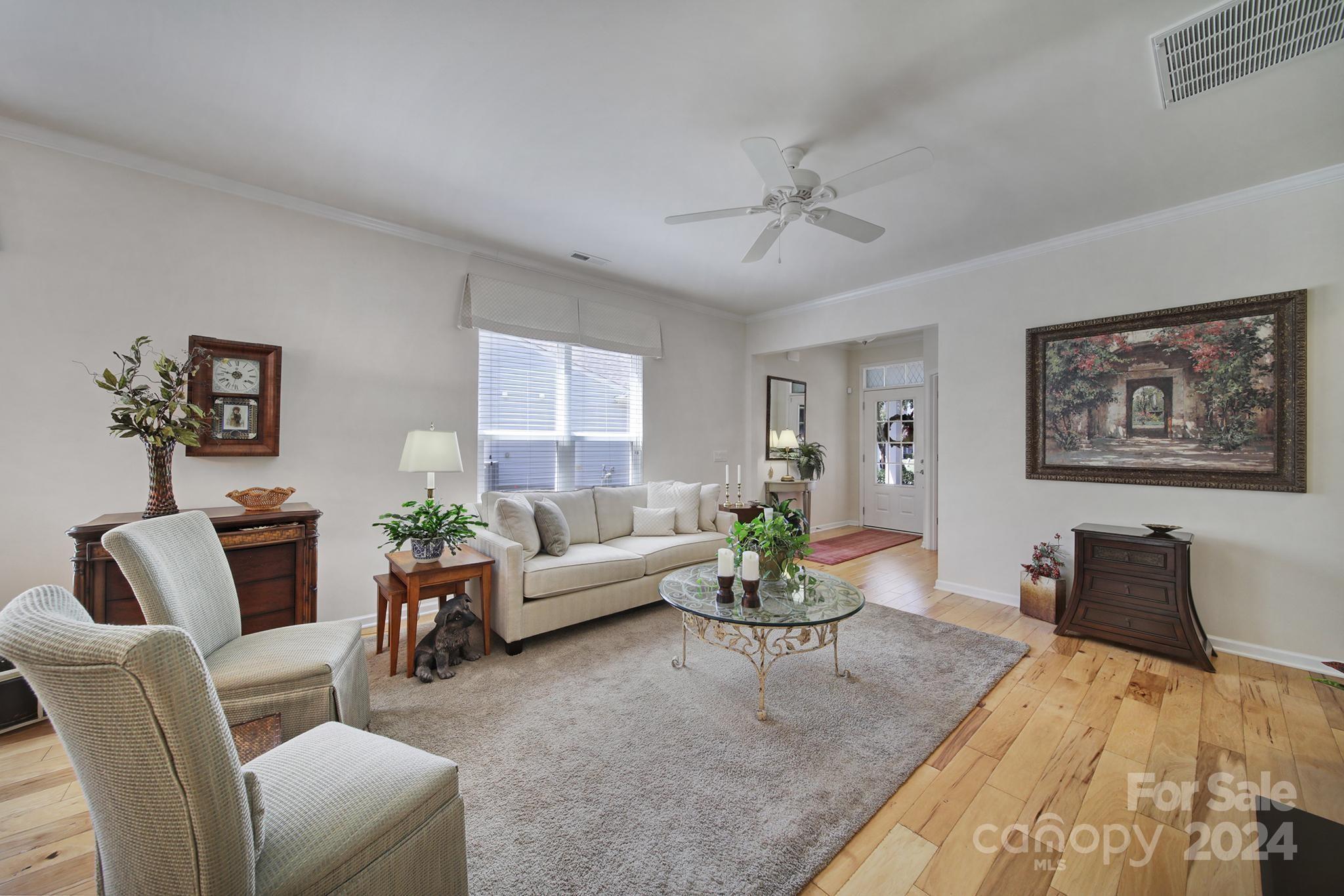 3055 Everett Lane Fort Mill, SC 29707 - Photo 6 of 40 a living room with furniture potted plant and wooden floor
