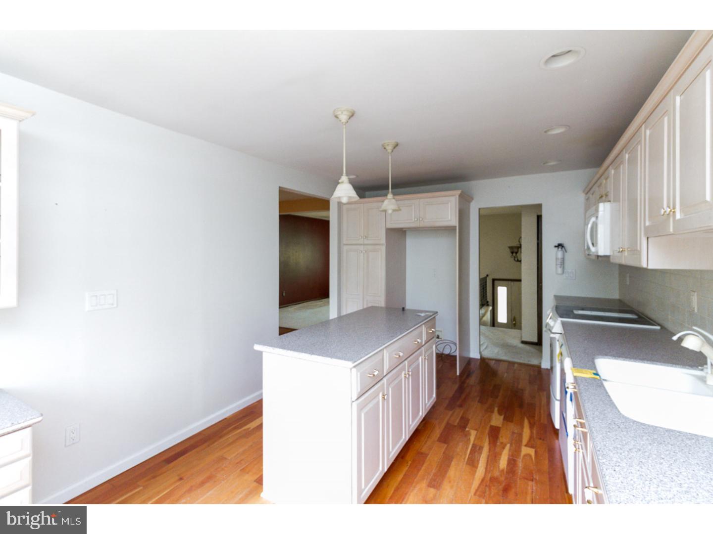 126 Buddtown Road Southampton, NJ 08088 - Photo 3 of 21 a kitchen with kitchen island a counter top space a sink and appliances