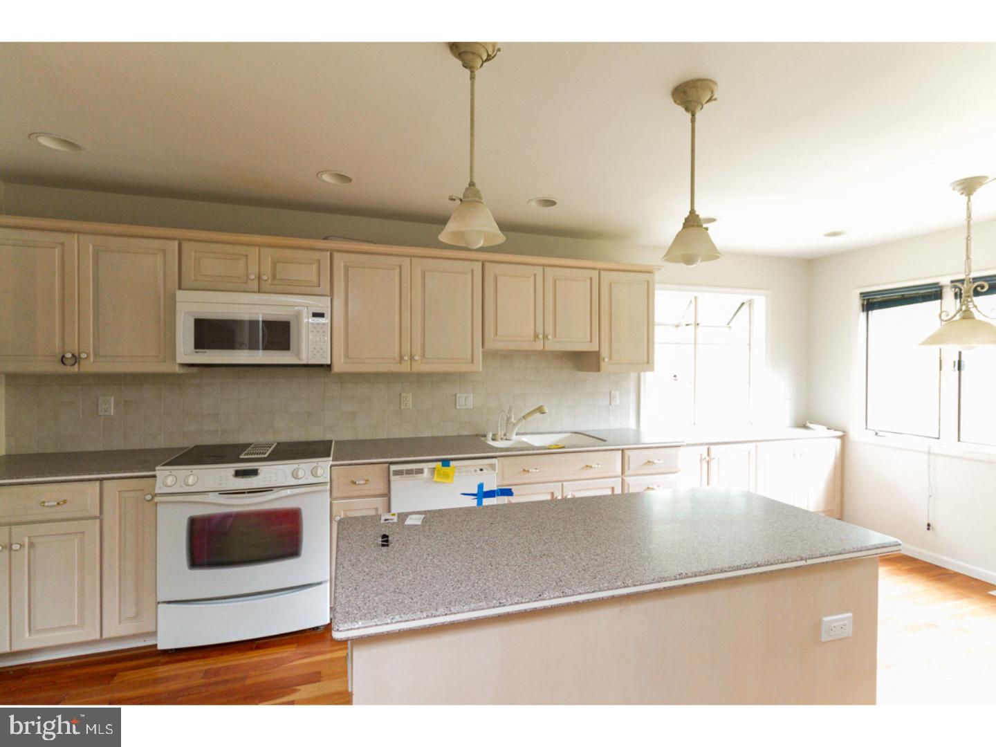 126 Buddtown Road Southampton, NJ 08088 - Photo 4 of 21 a kitchen with stainless steel appliances granite countertop a sink a stove and a microwave