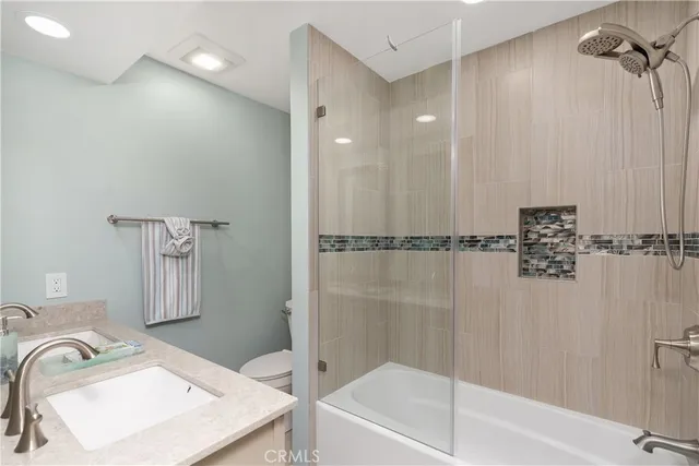 a bathroom with a bathtub and a sink