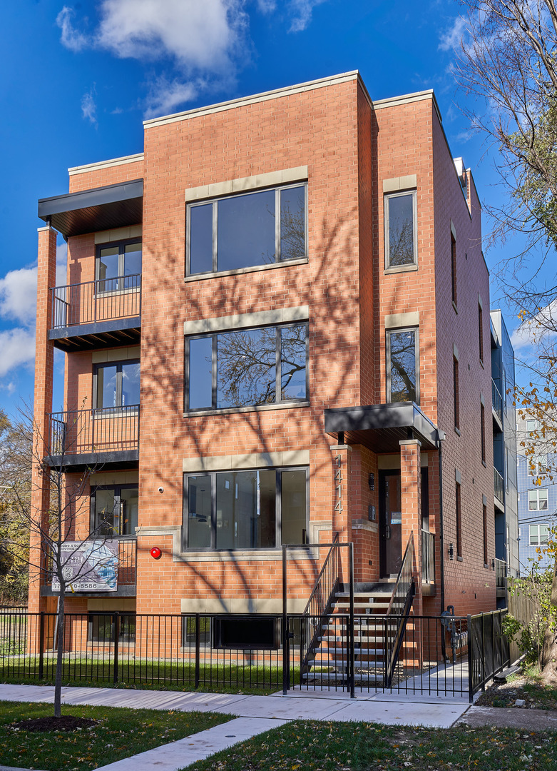 1414 East 65th Place, Unit 2A Chicago, IL 60637 - Photo 1 of 1 a view of a brick building with many windows