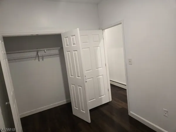 a view of front door with wooden floor