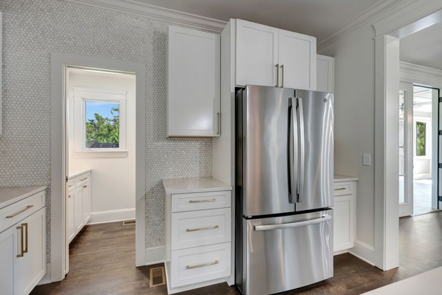 a kitchen with cabinets and stainless steel appliances