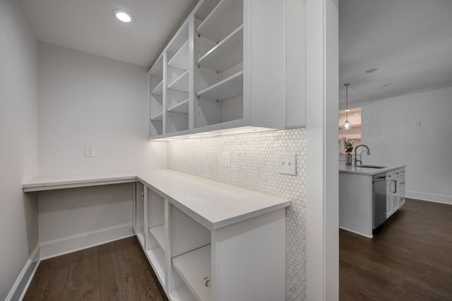 a storage room with wooden floor