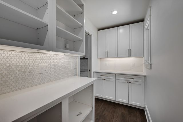 a view of cabinets with wooden floor