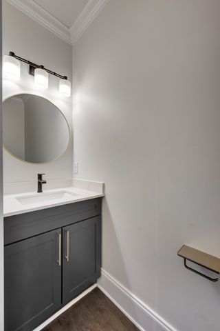 a bathroom with a sink and mirror