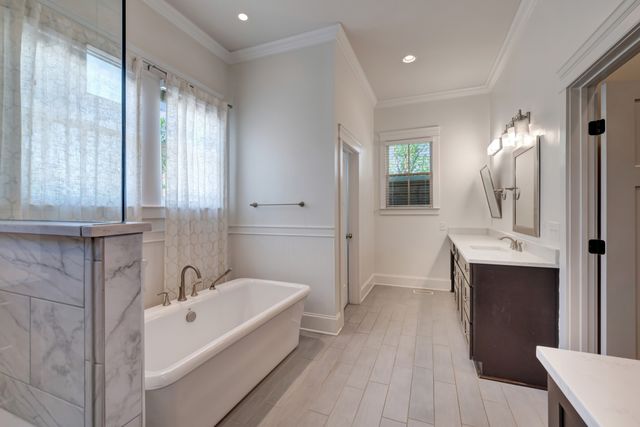 a spacious bathroom with a double vanity sink mirror double and shower