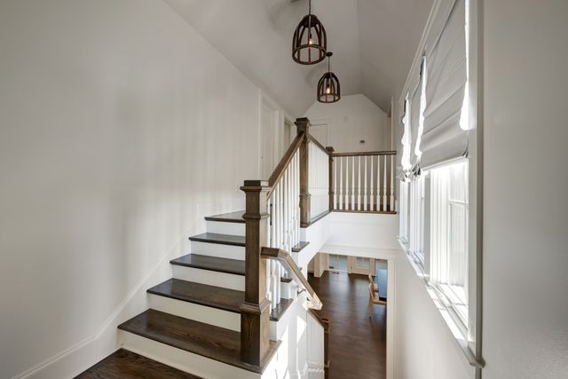 a bathroom with a sink a toilet a mirror and bathtub