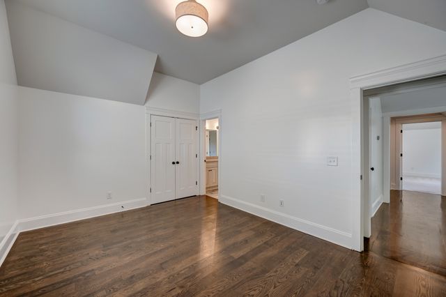 a bathroom with a shower a toilet and a sink