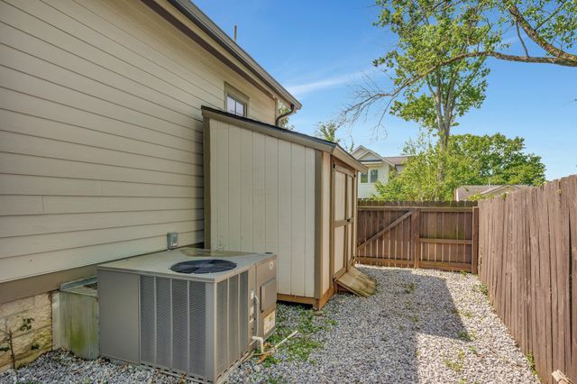a view of swimming pool with a patio and a yard