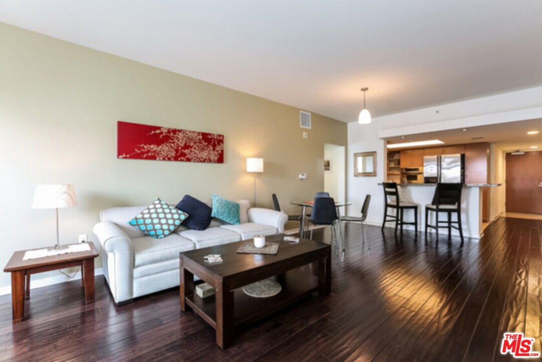 13700 Marina Pointe Drive, Unit 618 Marina del Rey, CA 90292 - Photo 6 of 22 a living room with furniture and wooden floor