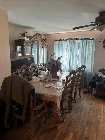 a view of a dining room with furniture and window
