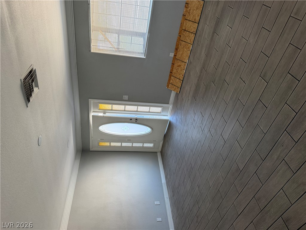 2820 South Sandhill Road, Unit A Las Vegas, NV 89121 - Photo 7 of 26 Enter into a foyer adorned with sleek tile flooring and ample overhead light.