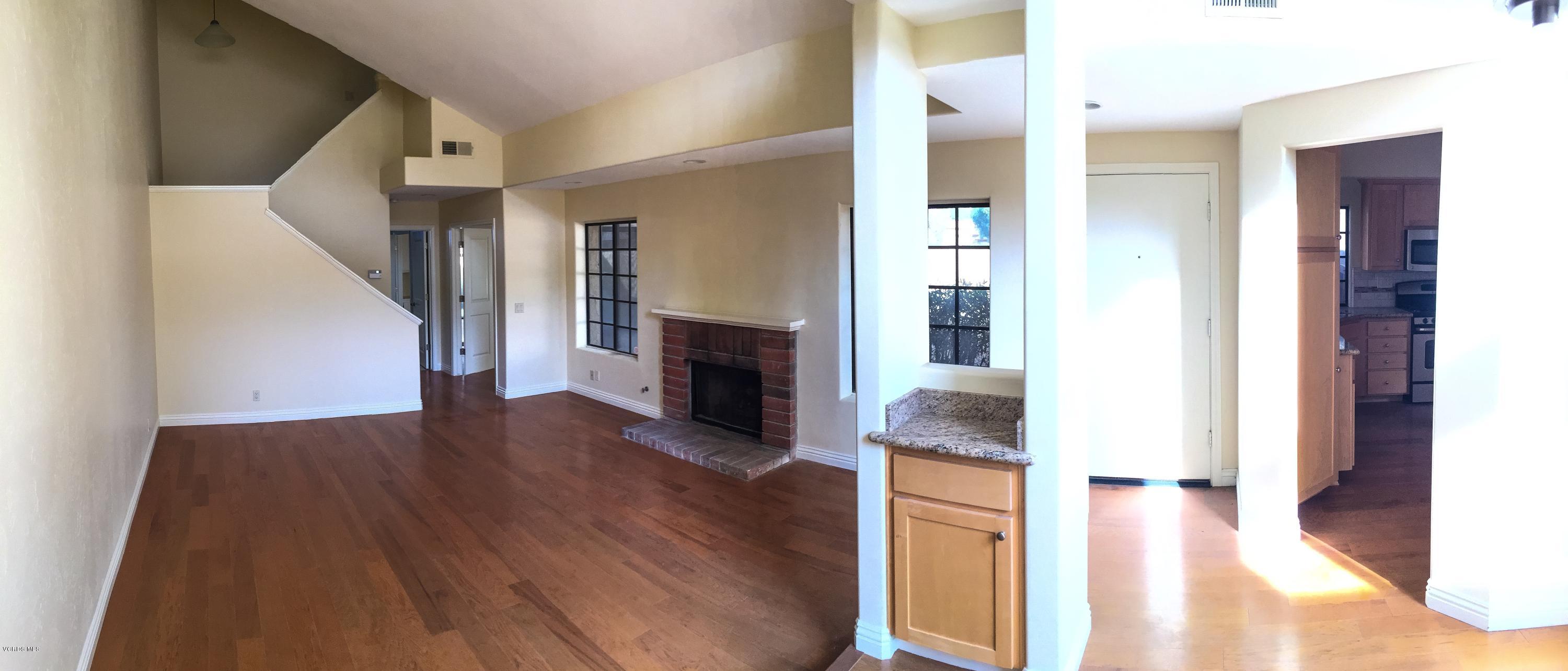 3701 Via Pacifica Walk Oxnard, CA 93035 - Photo 3 of 5 a view of a livingroom with wooden floor and a ceiling fan