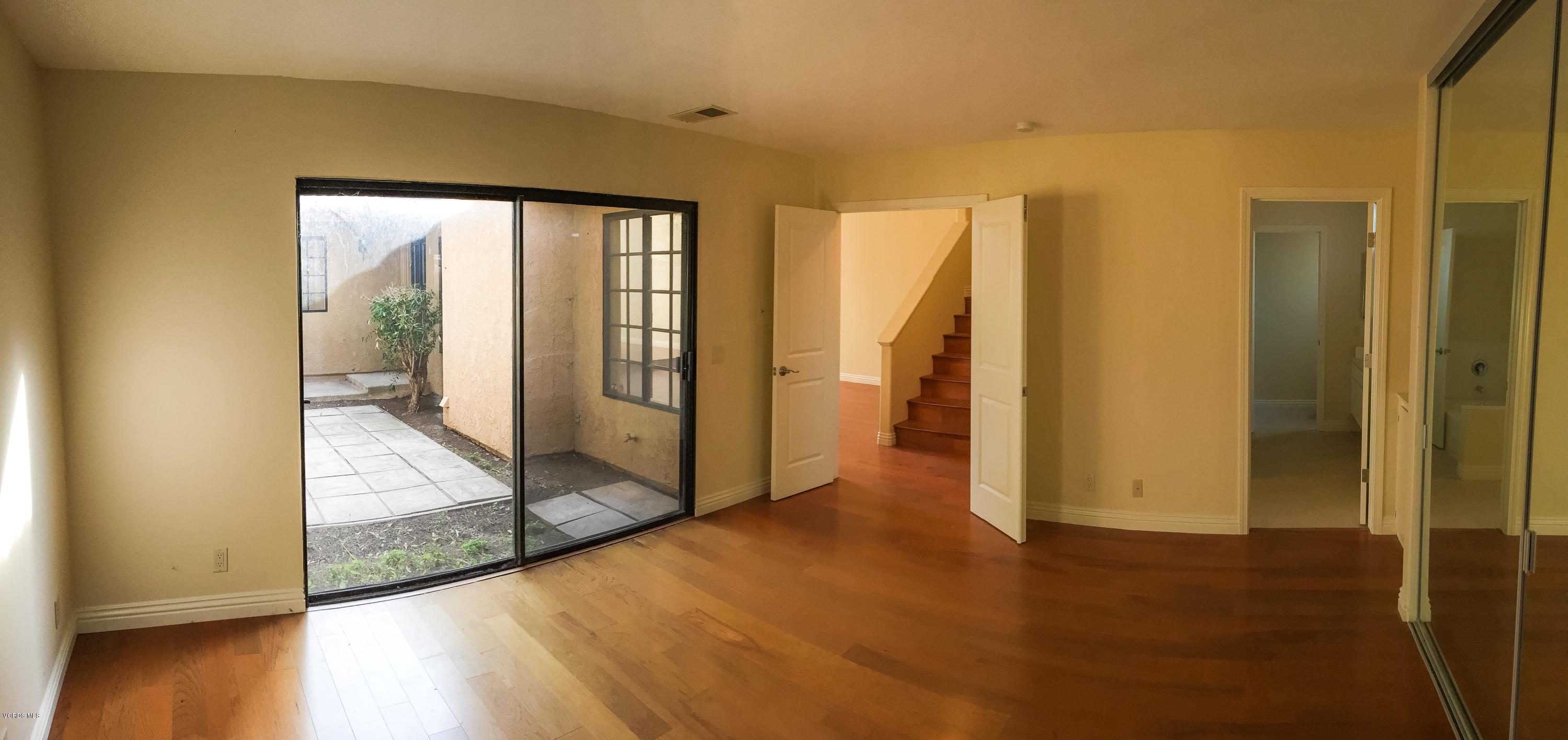 3701 Via Pacifica Walk Oxnard, CA 93035 - Photo 5 of 5 a view of a room with wooden floor and a balcony