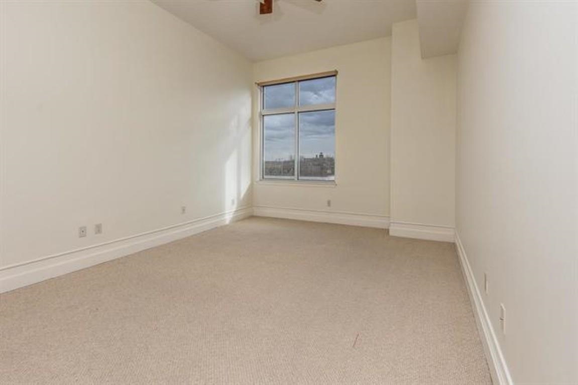 648 Riverside Drive, Unit 319 Memphis, TN 38103 - Photo 8 of 19 an empty room with a window