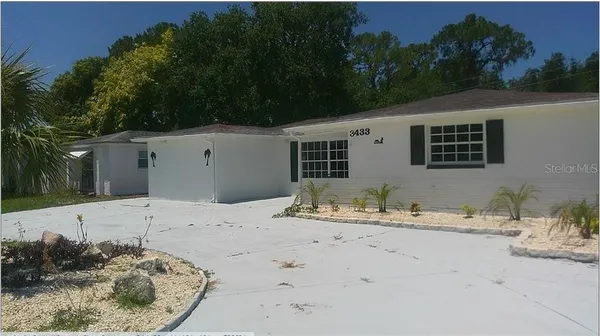 a view of a backyard of the house