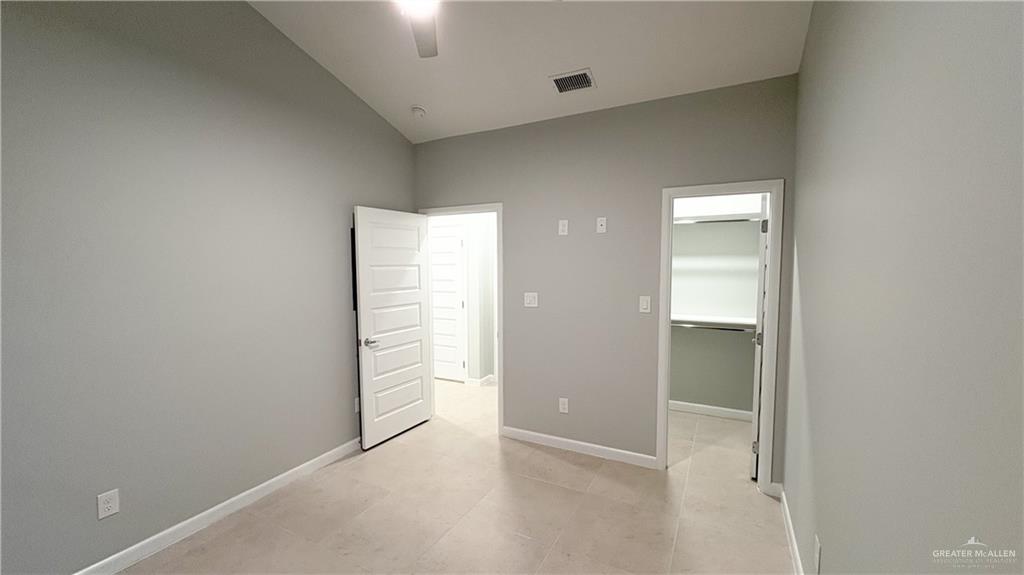 612 Oriole Road Weslaco, TX 78596 - Photo 14 of 16 an empty room with windows and closet
