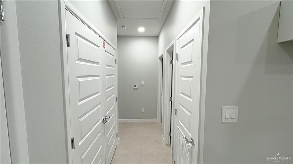 612 Oriole Road Weslaco, TX 78596 - Photo 9 of 16 a bathroom with a double vanity sink and a mirror