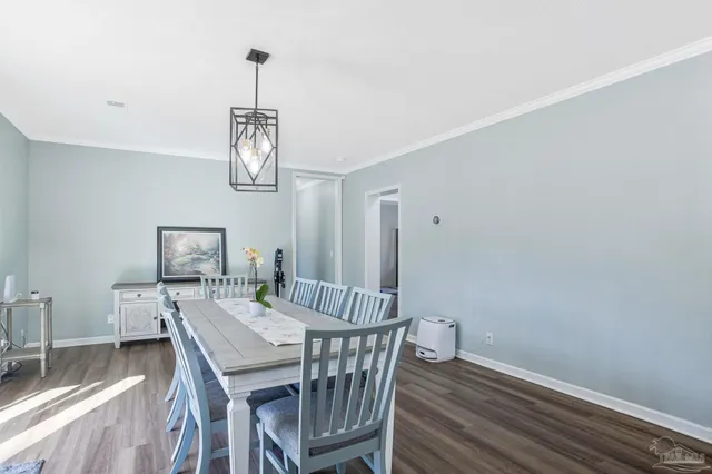 a bedroom with a bed and a ceiling fan
