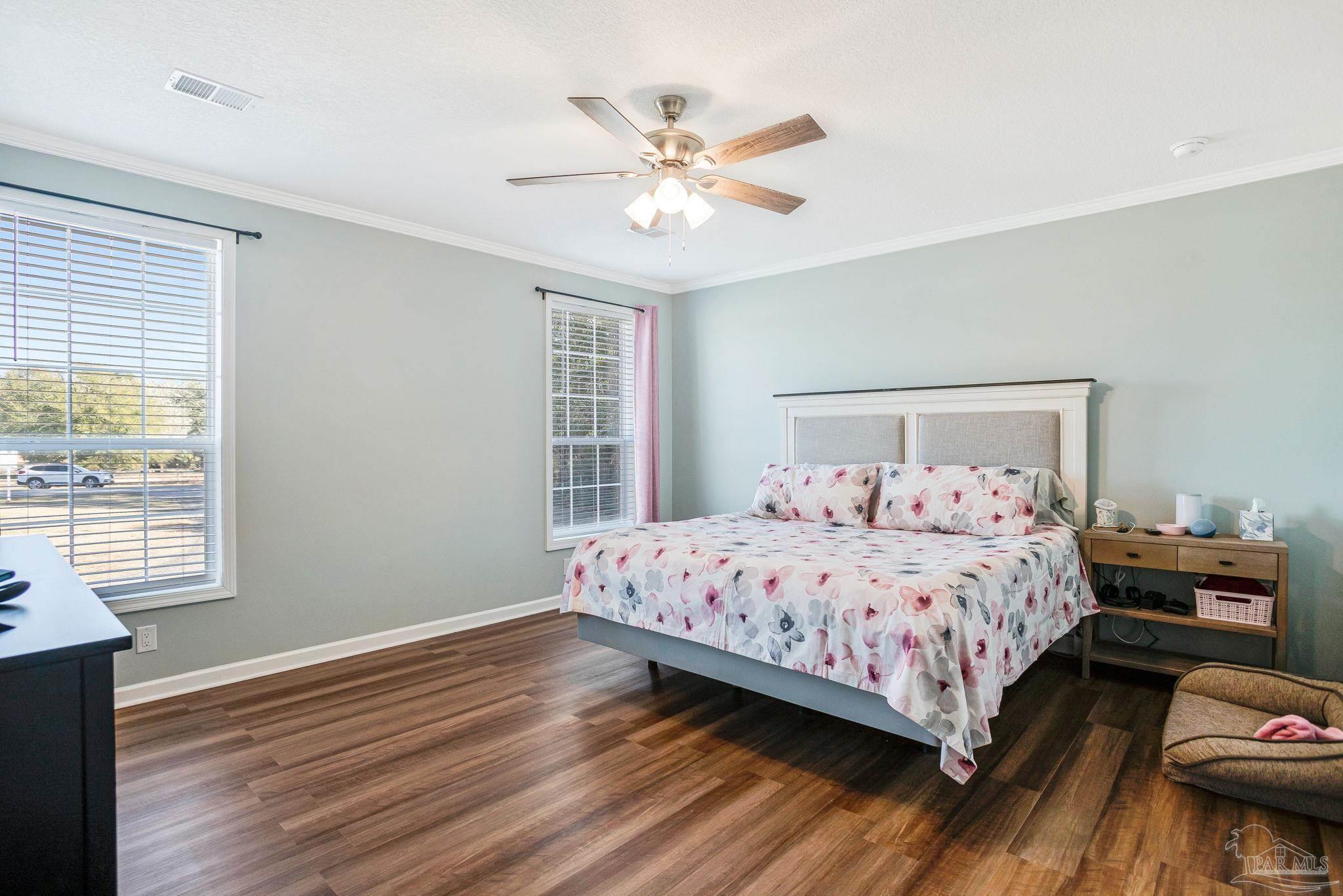 4955 Blue Ribbon Drive Milton, FL 32583 - Photo 14 of 43 a bedroom with a bed and window