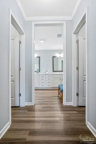 a bathroom with a granite countertop sink mirror and a bathtub