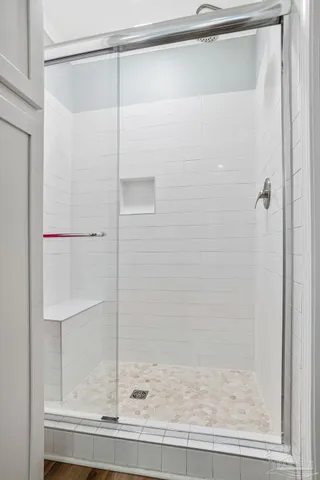 a bathroom with bathtub and window