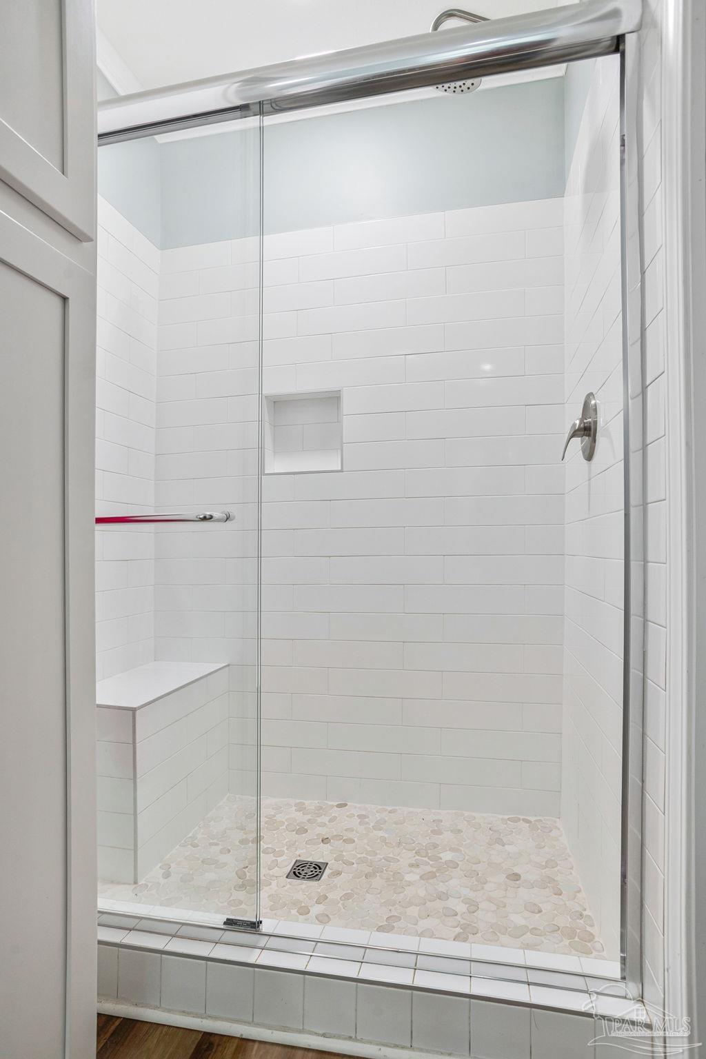 4955 Blue Ribbon Drive Milton, FL 32583 - Photo 19 of 43 a bathroom with a glass shower door