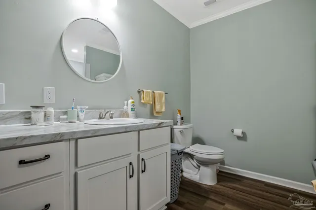 a bathroom with a sink toilet a mirror and shower