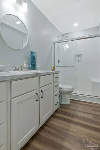 a bathroom with a glass shower door