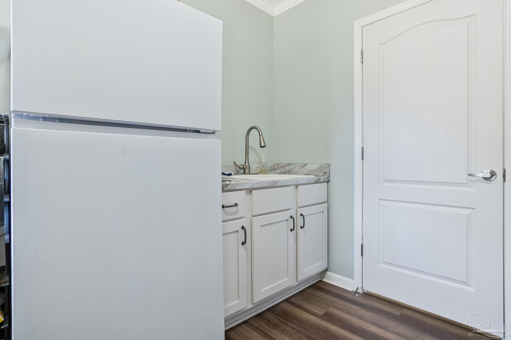 4955 Blue Ribbon Drive Milton, FL 32583 - Photo 31 of 43 a bathroom with a sink and a mirror