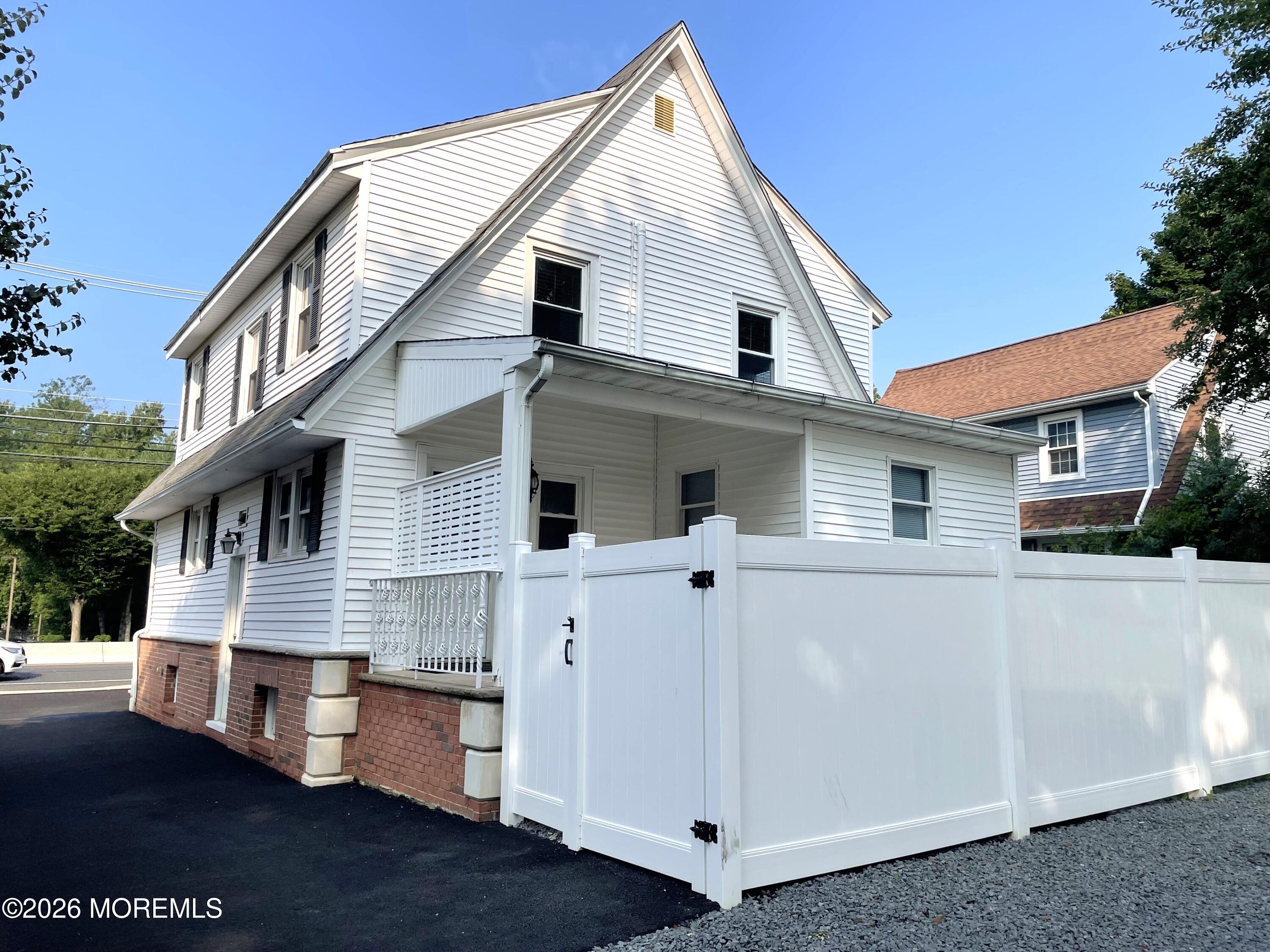 175 Highway 35 Red Bank, NJ 07701 - Photo 2 of 15 a front view of a house with a garage