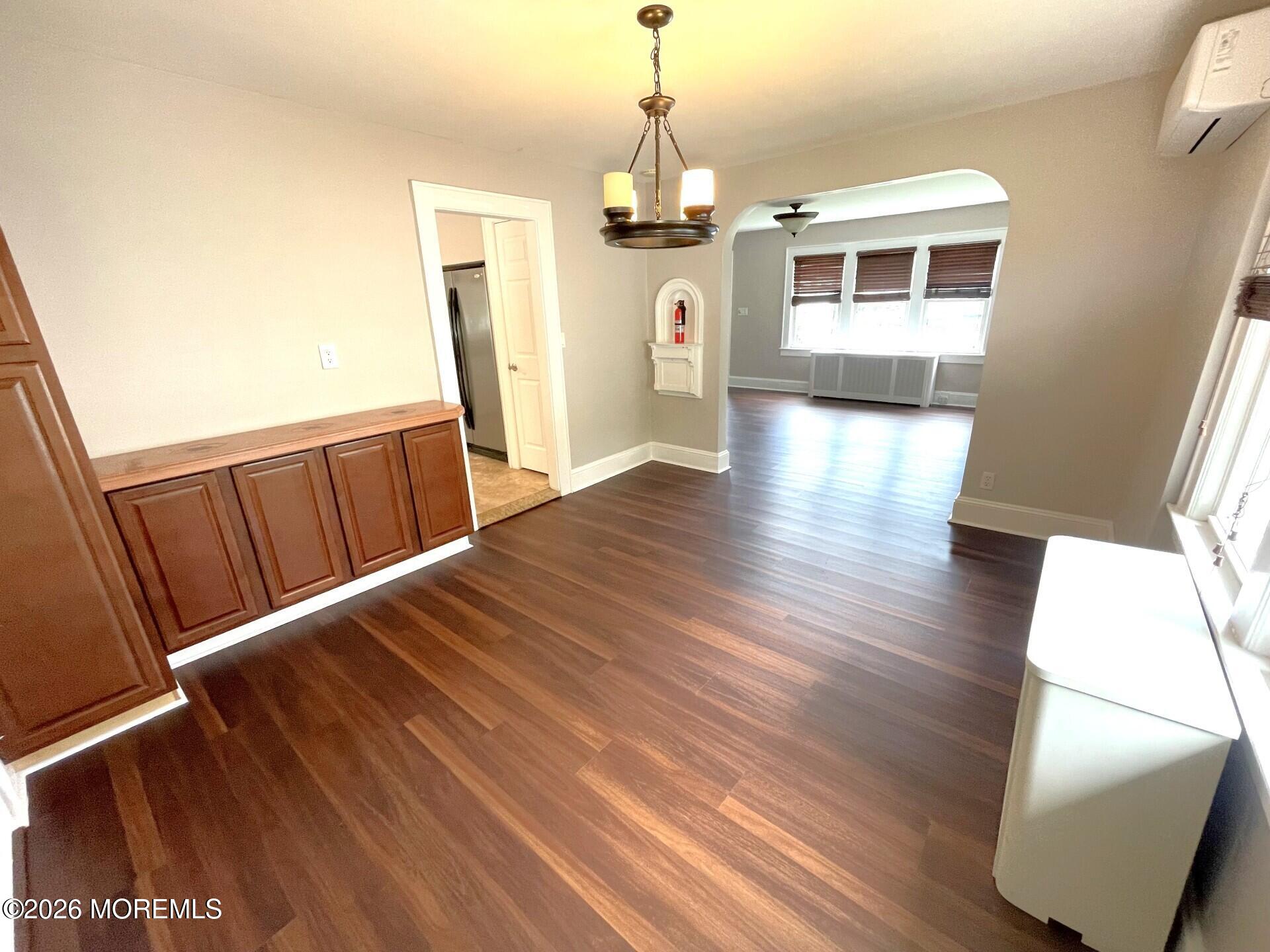 175 Highway 35 Red Bank, NJ 07701 - Photo 9 of 15 a view of a living room with wooden floor and stairs