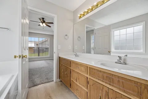 a white bath tub sitting next to a window