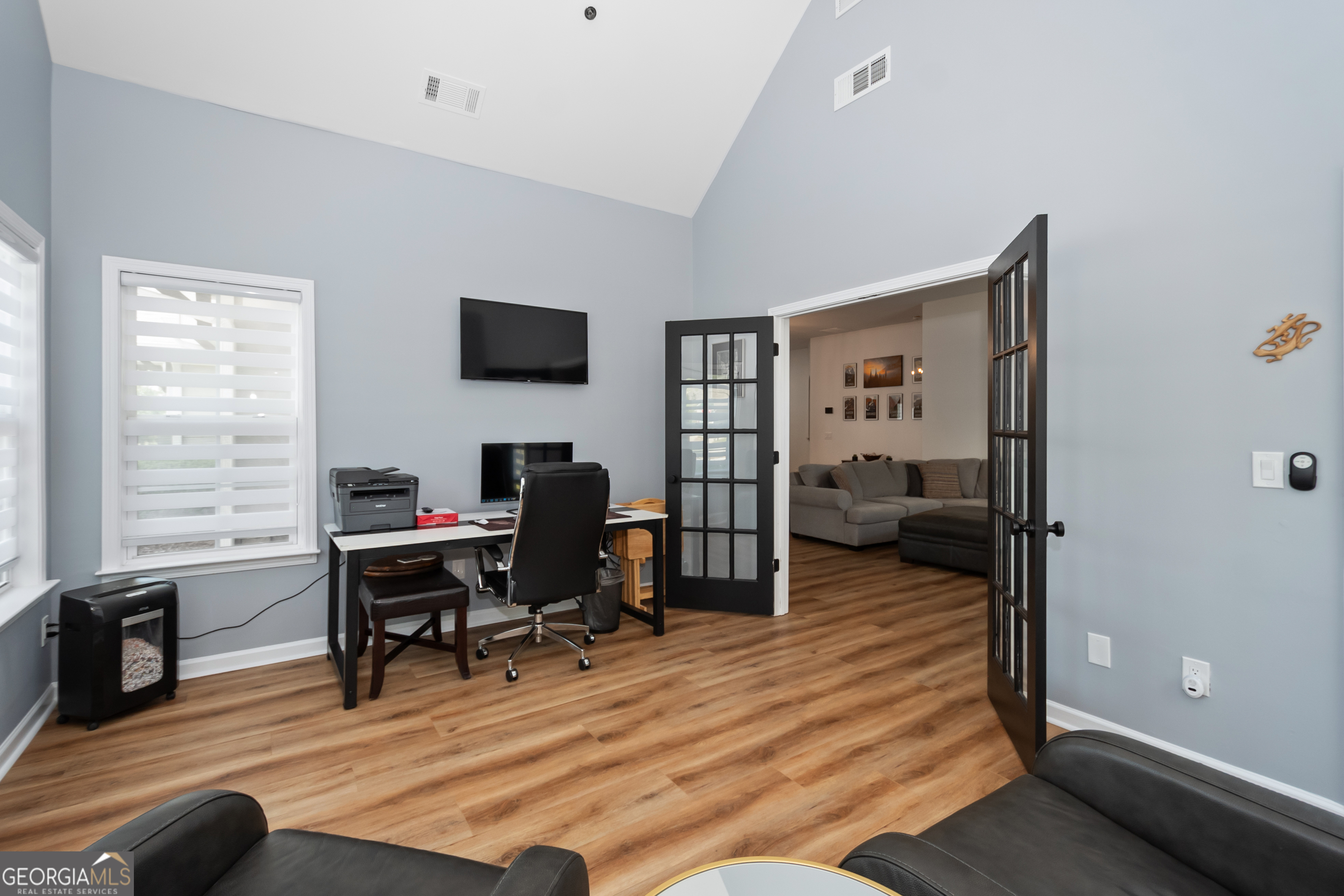 71 Thomaston Street Newnan, GA 30263 - Photo 17 of 38 a livingroom with workspace and a window
