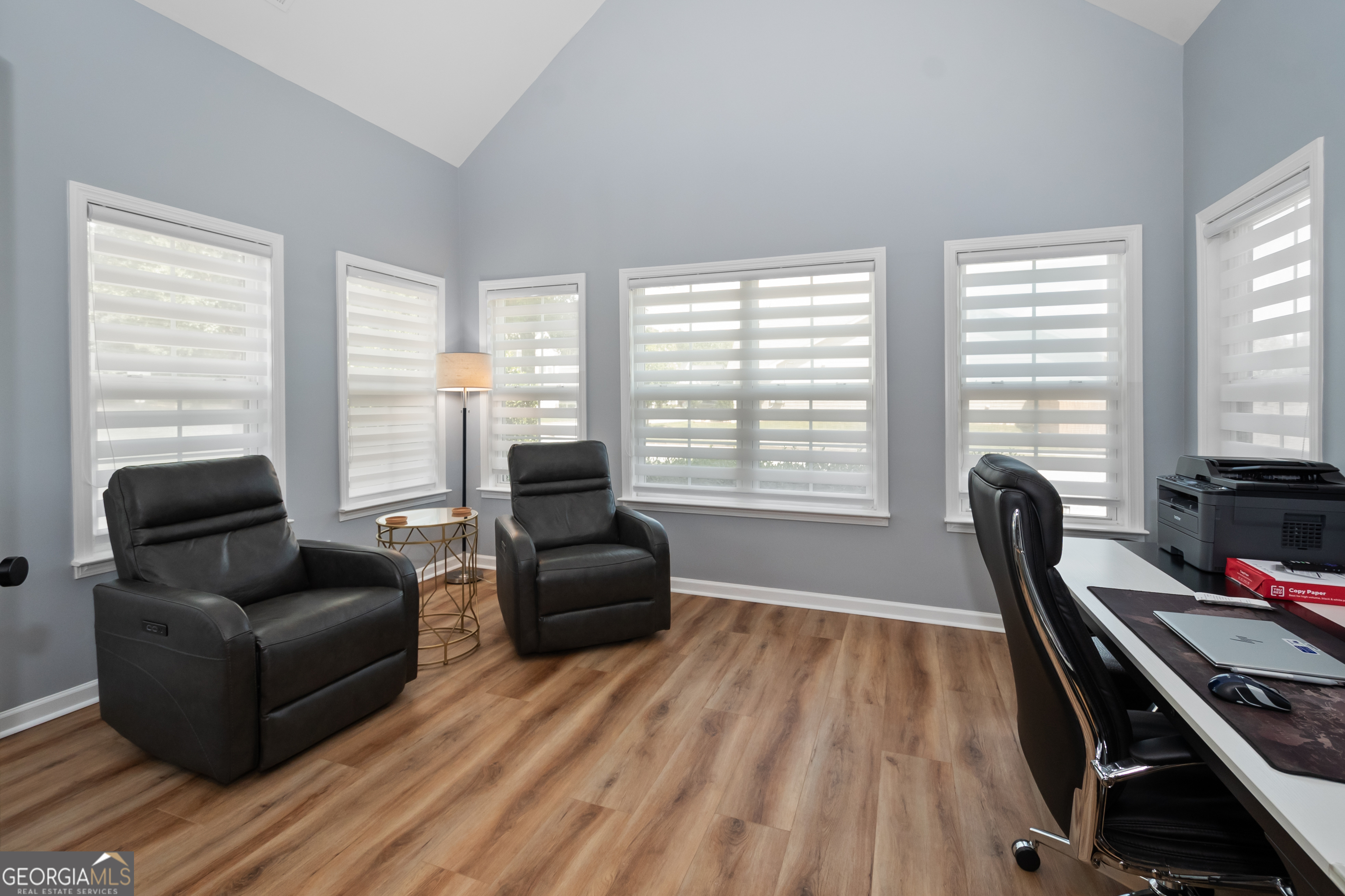 71 Thomaston Street Newnan, GA 30263 - Photo 18 of 38 a living room with furniture hard wood floor and a floor to ceiling window