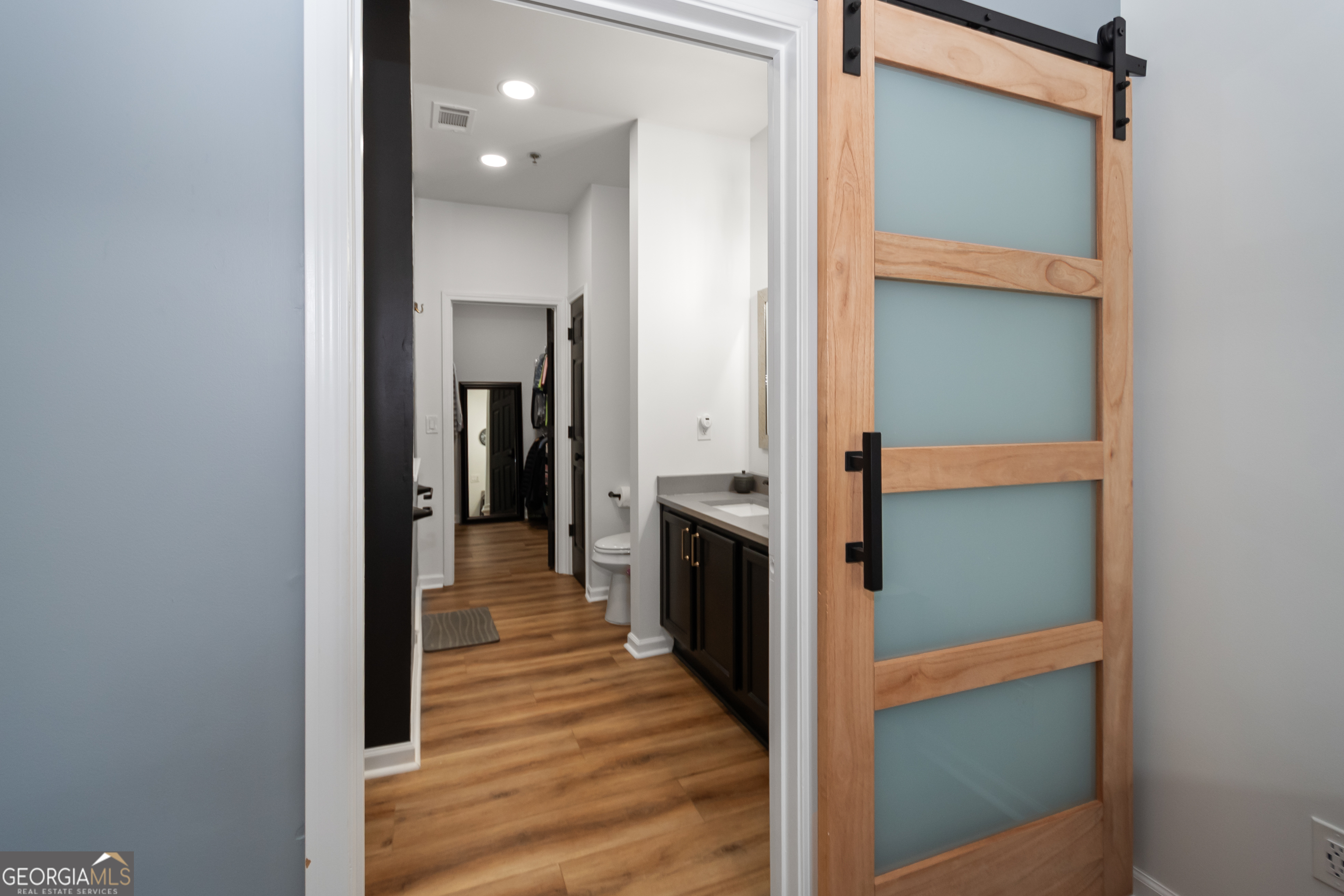 71 Thomaston Street Newnan, GA 30263 - Photo 21 of 38 a view of a hallway with wooden floor and staircase