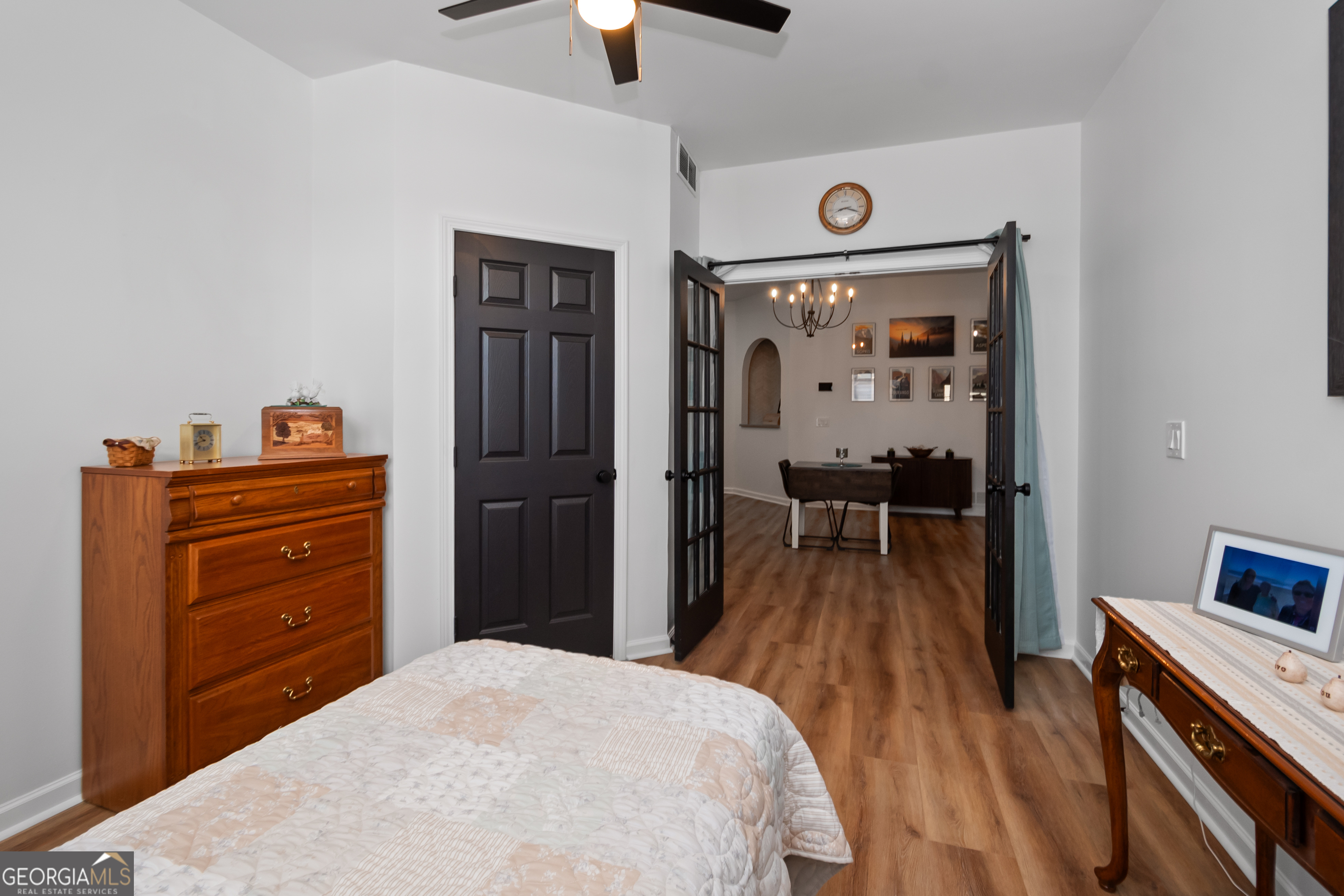 71 Thomaston Street Newnan, GA 30263 - Photo 30 of 38 a bedroom with a bed and wooden floor