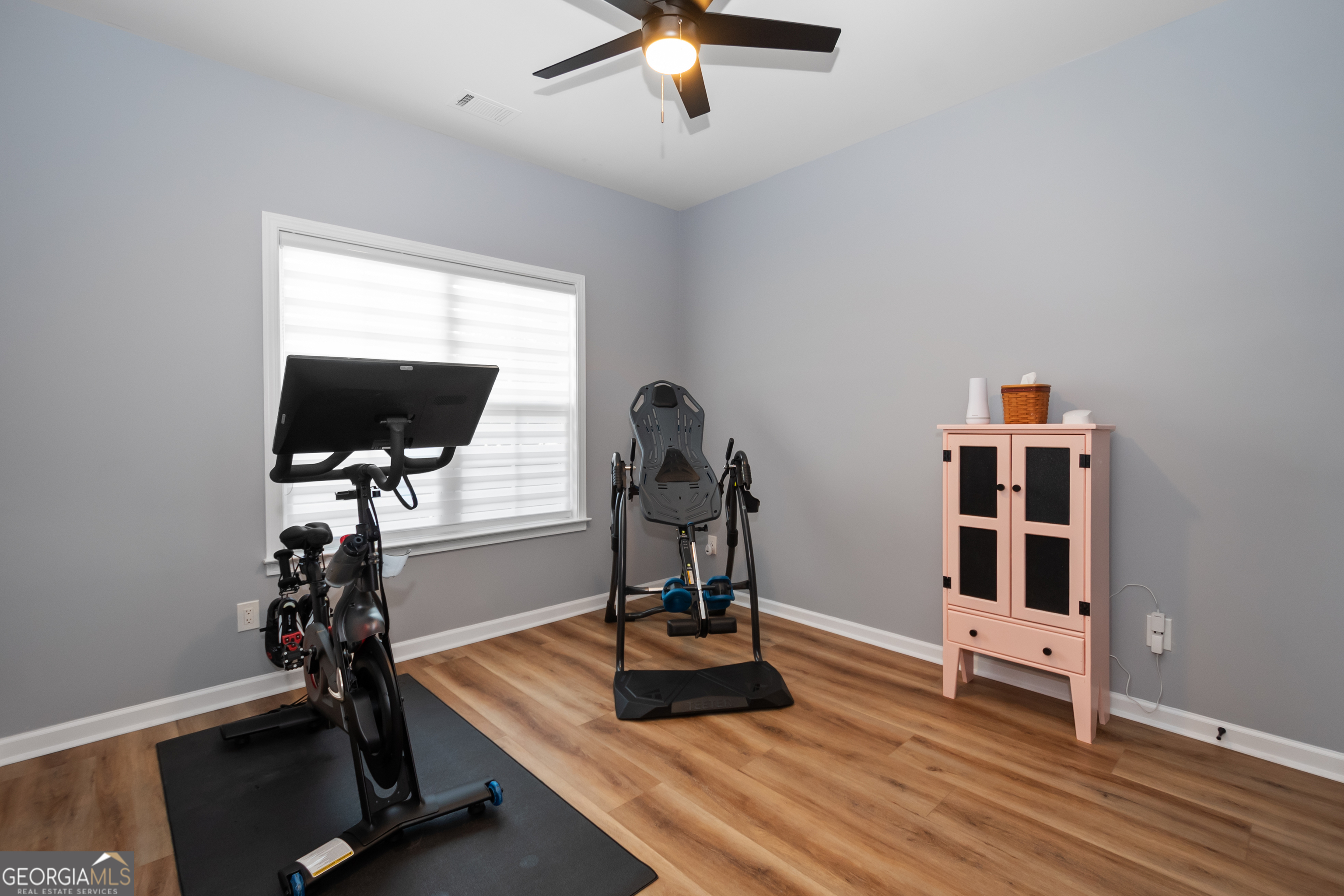 71 Thomaston Street Newnan, GA 30263 - Photo 31 of 38 a room with furniture and wooden floor