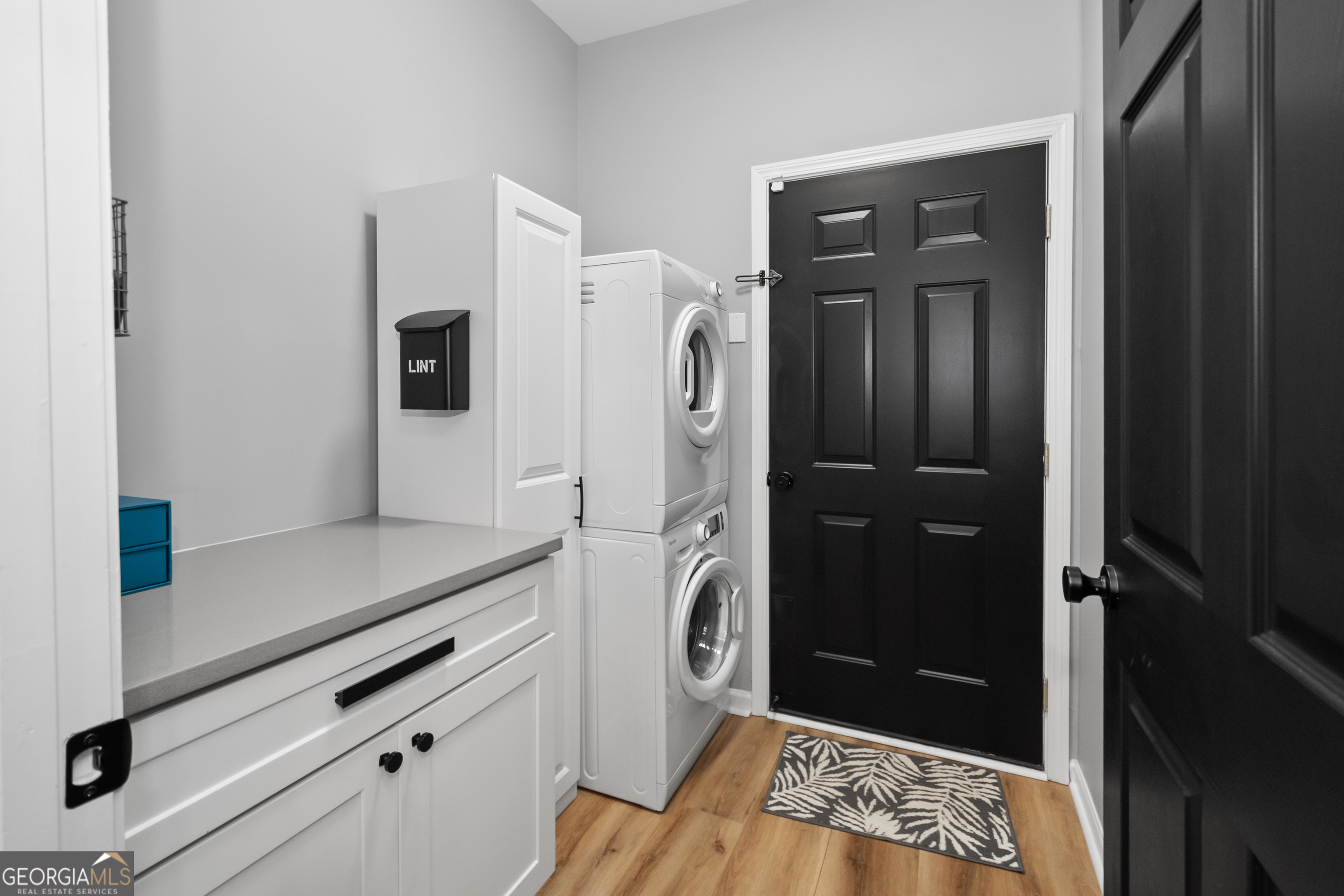 71 Thomaston Street Newnan, GA 30263 - Photo 33 of 38 a walk in closet with wooden floor