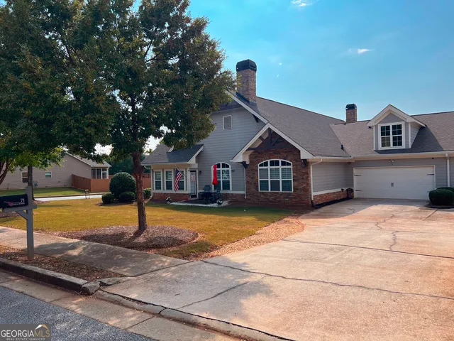 an aerial view of a house with a swimming pool